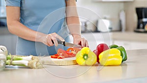 Woman preparing vegetables on the chopping board