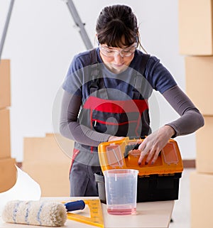 Woman preparing for wallpaper work