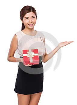 Woman with present and hand show with blank sign