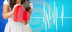 Woman present heartbox beside pulse line