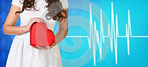 Woman present heartbox beside pulse line