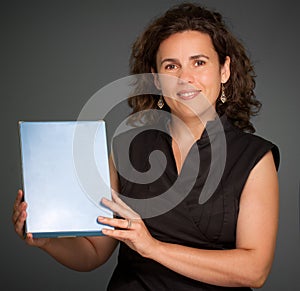 Woman presenting a blank box