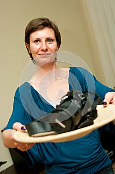 Woman Presenting a Camera