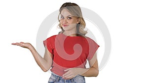 Woman presenting product with her hand showing to side on white