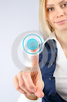 Woman presses a finger on the touch button