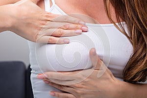 Woman Pressing Her Breast