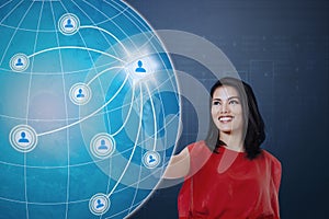 Woman pressing icon social on the globe