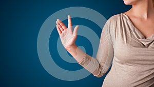 Woman pressing imaginary button