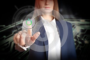 Woman pressing power button on virtual screen