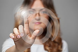Woman pressing touchscreen button