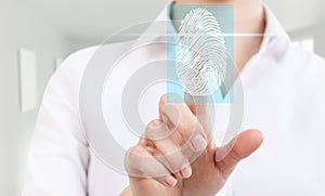 Woman pressing on virtual button with dactyloscopy scanner.