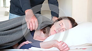Woman pretending to sleep afraid from violent husband