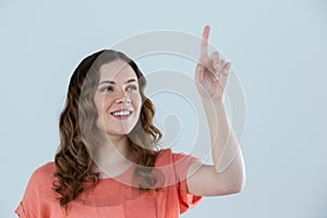 Woman pretending to touch an invisible screen