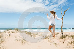 Woman on pristine seculuded beach Australia good vibes