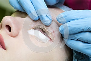 Woman on the procedure eyelash,