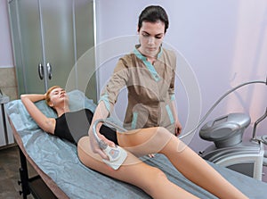 Woman is in the process at the clinic lipomassage