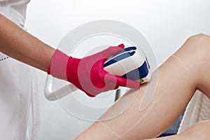 Woman in professional beauty clinic during laser hair removal