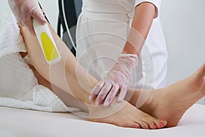 Woman in professional beauty clinic during laser hair removal