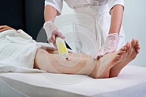 Woman in professional beauty clinic during laser hair removal