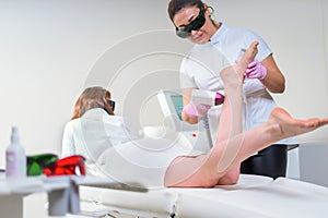 Woman in professional beauty clinic during laser hair removal. Epilation Treatment. Smooth Skin concept