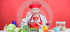 Woman professional chef hold bowl and spoon. Free healthy vegetarian and vegan recipes. Healthy raw food. Dieting