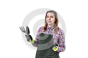 Woman professional gardener or florist in apron holding gardening tools isolated on white background