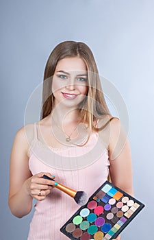 Woman with professional make-up artist Makeup kits