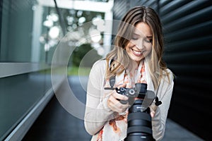 Woman is a professional photographer with dslr camera