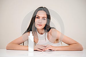 woman with professional shampoo for hair treatment