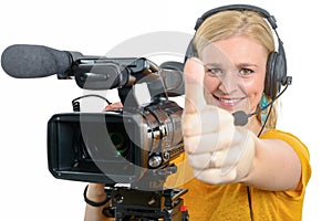Woman with professional video camera,showing thumb up
