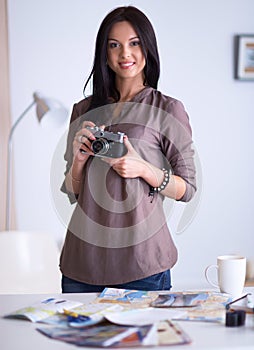 Woman is a proffessional photographer with camera