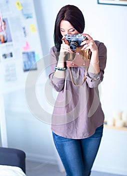 Woman is a proffessional photographer with camera