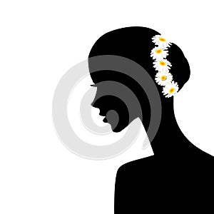 Woman profile with chamomiles in her hair