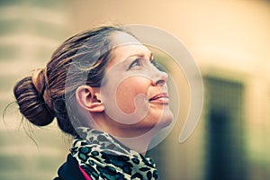 Woman profile looking up. Natural expression