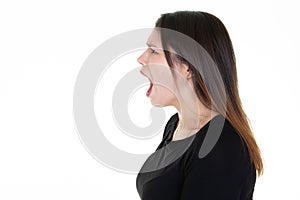 Woman profile shouting on white background with side copyspace