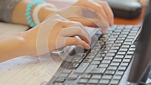 Woman is programming, woman is working on computer, female hands on keyboard close-up