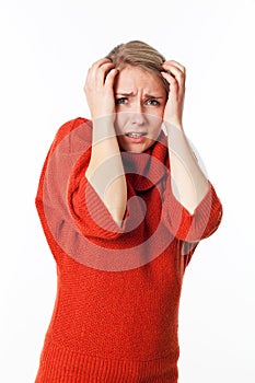 Woman protecting herself with her arms against violence