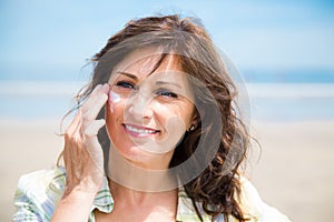 Woman protecting skin from sun
