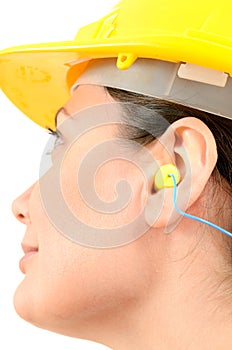 Woman with protective equipment and earplugs