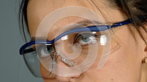 Woman in protective glasses.