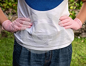 Woman in protective gloves