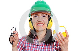 Woman with protective helmet, headphones, mask and spectacles