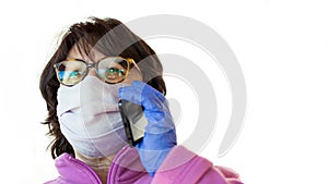 Woman in protective mask and protective gloves talking on phone while coronavirus and pandemic. Business and work online while photo