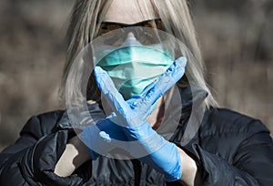 Woman in protective sterile medical mask on her face