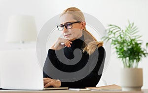Woman psychologist consulting client online on computer photo