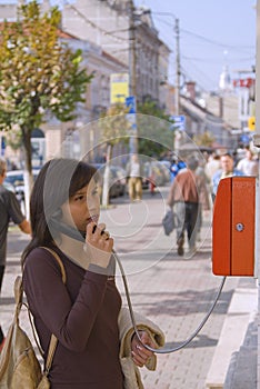 Woman at the public phone