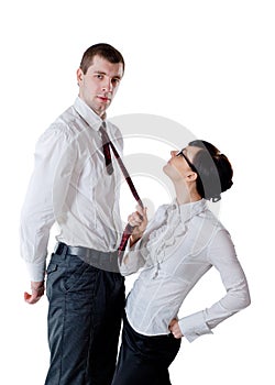 Woman pull a man by necktie