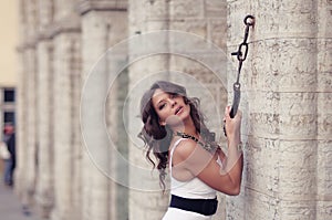 Woman Pulling On Chain In Wall