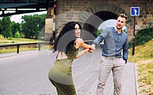 woman pulling guy`s hand