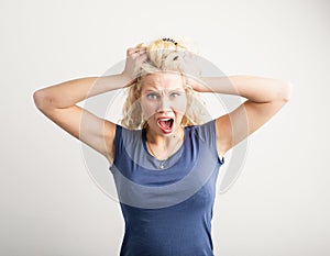 Woman pulling her hair out photo